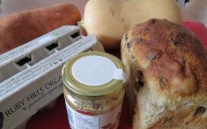 Eggs, sweet potato, pumpkin, tahini and bread on a kitchen benchtop