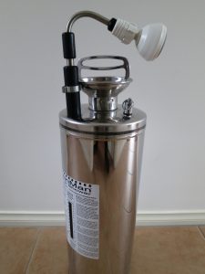 Metal cylinder with telescopic showerhead and pump handle