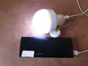 USB battery bank with battery powered LED light plugged in