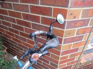 Mirror attached to bar end of handlebar